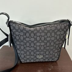 Coach Brand. Black Smoke Color With Leather Crossbody Strap. Logo Design All Over. Dustcover Inside Purse. Sig Small Dufflette. New With Tags. Inside Purse, Bags Coach, Crossbody Purse, Crossbody Strap, Coach Bags, Purses Crossbody, Leather Crossbody, Black Gray, Black And Grey