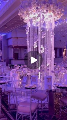 an event with chandeliers and tables set up