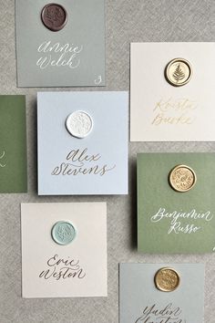 six different types of buttons on cards with names and date printed on them in gold, silver, or green