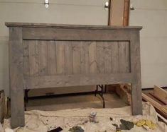 an old wooden headboard is being worked on