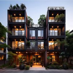 an apartment building with many balconies and plants on the balconys at night