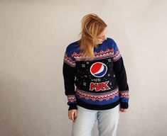 Old-school unisex sweater from the 90s from Pepsi. Original retro sweater with colorful patterns. I recommend this beautiful navy blue sweater with blue, red and white patterns. Material: 50% wool 50% acrylic Very good vintage condition Check the dimensions provided (double on the floor please) arms: 55 cm chest: 50 cm length: 66 cm The size on the label is L, in my opinion M-L Model's height: 171 cm Due to camera and your monitor settings colors may appear slightly different than they are in real life. PLEASE read description. For better fitting I would suggest you compare measurements to a garment that you have in your closet to ensure a proper fit. NO RETURNS in case of the bad fit! SHIPPING: the item will be ship like priority mail from Europe. I'm not responsible for delays due to cus Blue Retro Winter Sweatshirt, 90s Red Winter Sweater, Red 90s Style Winter Sweater, 90s Inspired Long Sleeve Winter Tops, 90s Blue Winter Sweater, Pepsi Vintage, Pepsi Max, 90s Casual, Patterned Sweater