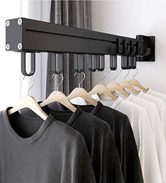 there is a rack with clothes hanging on it