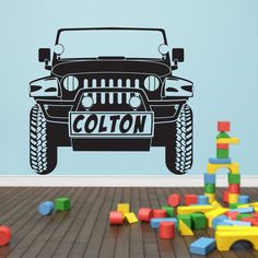 a wall decal with the word cotton on it in front of a black jeep