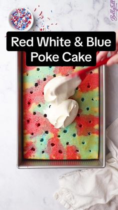 red, white and blue poke cake in a pan with sprinkles on top