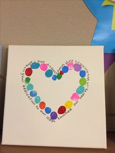 a heart made out of colored circles on a white canvas with the words happy valentine's day written in it