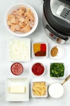 the ingredients for this meal are in bowls next to an air fryer and rice cooker