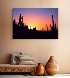 the sun is setting behind cactus trees in this desert scene with vases and other decorative items