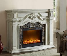 a white fireplace in a living room next to a chair