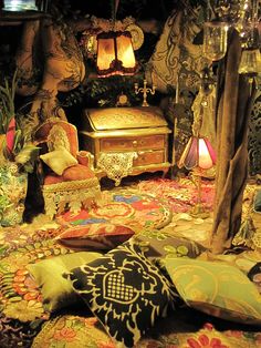 a living room filled with lots of furniture and decor on top of a carpeted floor