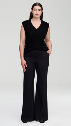 Inspired by vintage menswear, this cozy merino wool v-neck vest features a classic cable pattern. Designed to be worn alone as a top or layered over another shirt, the cropped, oversized silhouette is a daily wardrobe favorite. Complete your ensemble with wide-leg trousers, minimalist jewelry, and perfectly worn-in loafers. Vintage Menswear, Cable Pattern, Flare Trousers, Oversized Silhouette, Women's Sweaters, Navy Stripes, Wide Leg Trousers, Minimalist Jewelry, Get Dressed