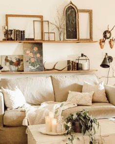 a living room filled with lots of furniture and decor on top of a wooden table