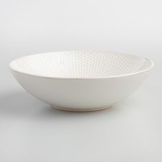 a white bowl sitting on top of a table