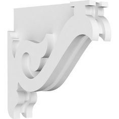 the corner bracket is made out of white foam and has an ornate design on it