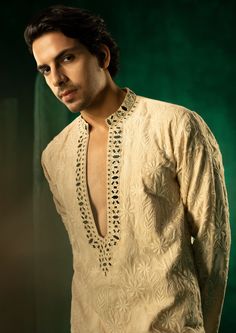 The garment is made in georgette, with chikankari embroidery patterns designed, embroidered and embellished with mirrorwork in house, and styled by the designers at our studio with the finest details. Luxury Chikankari Embroidery Blouse For Festive Occasions, Mans Kurta Embroidery Design, Men Embroidery Kurta Design, Ethnic Wear Men Indian, Man Kurta Designs Style, Kurta Neck Design For Men, Mens Kurta Embroidery Designs, Indian Mens Fashion