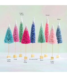 there are many different colored trees on sticks