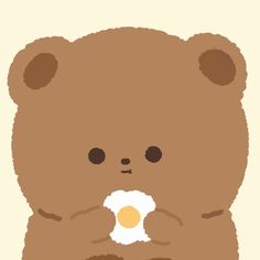 a brown teddy bear with an egg in its mouth