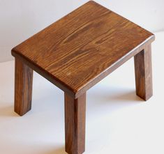 Vintage small solid oak wooden stool with an oblong seat and four square shaped legs. Tough thick legs and seat make it very strong. Nicely varnished. Source: France Origin: France Age: Vintage Condition: in good solid vintage condition with slight signs of previous use, some scuffs on one leg Height: 26cm/10" Width: 34cm/13.5" Depth: 26cm/10" Unpacked weight: 2.8kg   Find. Similar item is here: https://www.etsy.com/listing/1232441030/vintage-wood-stool-small-side-table?click_key=f4a8cc0b349b95e