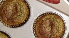 three muffins sitting in a cupcake tin