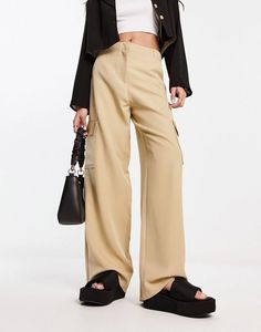 These high-rise slouchy wide leg cargo trousers are perfect for all your Instagram travel snaps. Pair them with your fave cropped tee and trainers for laidback luxury. The neutral hue blends seamlessly with all your spring outfits while the multiple pockets provide plenty of hidden storage for all your daily essentials. Boasting a flattering wider leg cut and comfortable stretch fabric, you'll feel confident exploring new places in this versatile piece that's worth showing off online and IRL. Neutral Trousers, Instagram Travel, Trouser Pants Women, Cropped Tee, Cargo Trousers, Hidden Storage, Daily Essentials, Pants Trousers, Personal Shopping