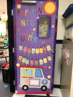 a purple door decorated with pictures and words in the shape of a bus is shown