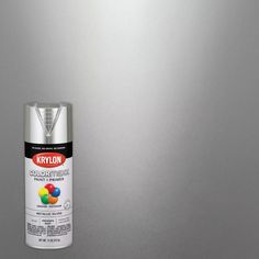 a spray can of krylon metallic paint on a metal surface, with the top off