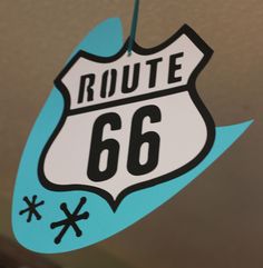 a route 66 sign hanging from the ceiling