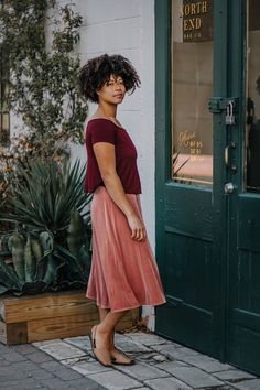 "The Velvet Midi Skirt drapes beautifully with just the right amount of flare.  Pair it with simple body con tops, cropped sweaters, or the matching Velvet Flutter Top for a dress look! - High waist: encased elastic waistband - Fit & flare style - Size S length: approximately 30\" - Hits at mid-calf - Pictured skirts: Pink Mauve size Medium.  Jet Black size Small. - Video shows Pink Mauve Infinity Scarf for fabric color reference Choose between 5 velvet colors: - Pink Mauve - Plum Purple - Dark Velvet Midi Skirt, Skirt Draping, Skirts Midi High Waisted, Dark Olive Green, Velvet Collection, Flowy Blouse, Plum Purple, Velvet Color, Stretch Velvet