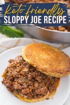 a sloppy joe sandwich on a white plate