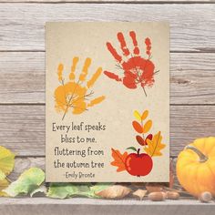 an autumn card with hand prints on it