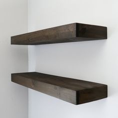 two wooden shelves mounted to the wall