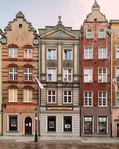 several old buildings line the street in front of each other