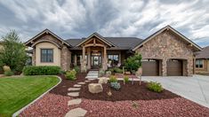 a large house with landscaping in front of it