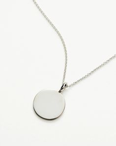 Engravable Round Necklace | Sterling Silver. Make It Personal with a Necklace. Paired with a Delicate Chain, the Smooth Clip-On Pendant Can be Engraved on Both Sides – the Perfect Gift for that Special Someone. Opt for the Engravable Round Disc Pendant. Please Note: Engraving Items May Take 7-10 Working Days to Process. Pendant Metal: Sterling Silver Pendant Dimensions: 15mm Short Plain Chain: Total Length 450mm with Extension Links at 410mm, 430mm and 450mm Weight: 4. 3 Gproduct Code: En-S-N1-N Silver Circle Necklace With Polished Finish, Classic Silver Initial Pendant Chain Necklace, Elegant Sterling Silver Coin Necklace With Round Pendant, Classic Silver Chain Necklace With Initial Pendant, Engraved Round Disc Medallion Necklace In Sterling Silver, Elegant Engraved Round Disc Medallion Necklace, Engraved Sterling Silver Round Disc Medallion Necklace, Personalized Sterling Silver Round Pendant Medallion Necklace, Elegant Personalized Round Pendant Medallion Necklace