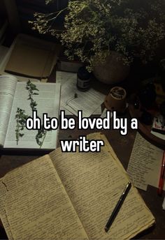 an open book sitting on top of a desk next to a pen and paper with the words oh to be loved by a writer