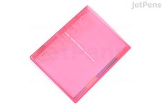 a pink notebook with writing on the front and back cover is laying flat against a white background