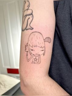 a person with a tattoo on their arm