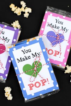 three valentine's day cards with popcorn on the side and you make my pop