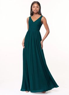 a woman in a long green dress