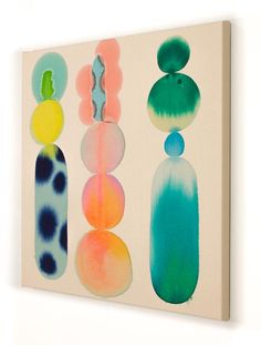 an abstract painting with different shapes and colors on a white background, hanging on a wall