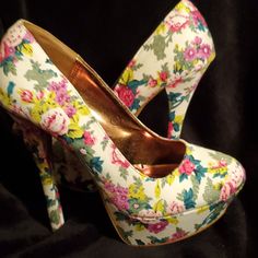 Fun Floral Round Toe Platform Pump. Never Worn. White Fabric With Pink And Green Floral Pattern.4+Inches White Floral Print Party Heels, Chic White Heels With Floral Print, Chic White Floral Print Heels, Chic Fabric Heels With Floral Print, Casual White Heels With Floral Print, White Fabric High Heels, White Fabric Heels For Party, Chic Floral Print Fabric Heels, White Fabric Party Heels