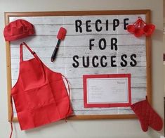 a sign that says recipe for success with red aprons and cooking utensils