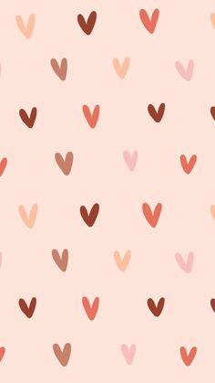 a pink and brown heart pattern with small hearts on the back ground, all in different colors