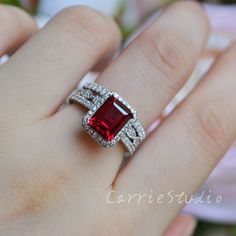 Emerald Cut Lab Ruby ring, material 925 sterling silver, plated with white gold, beautiful as promise ring. Main Stone: Lab Created Ruby Cut: Emerald Dimension: 7*9 mm Side Stone: CZ CS0362 Processing time 12-18 days, ship by express shipping when it's ready, if have custom request please contact. Emerald Cut Ruby Ring Gift, Emerald Cut Jewelry For Valentine's Anniversary, Elegant Emerald Cut Jewelry For Valentine's Day, Jewelry With Halo Setting And Rectangular Stone As Gift, Rectangular Stone Jewelry With Halo Setting As Gift, Ruby Ring With Radiant Cut As A Gift, Ruby Ring With Radiant Cut Center Stone For Gift, Radiant Cut Ruby Ring As A Gift, Radiant Cut Ruby Rings As Gift