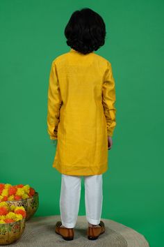 Yellow cotton silk kurta with mirror embroidery. Comes with off-white pyjama.
Component: 2
Pattern: Embroidered
Type Of Work: Mirror
Neckline: Band collar
Sleeve Type: Full
Fabric: Cotton silk, Lining : Cotton
Color: Yellow
Other Details: 
Closure : Buttons
Occasion: Festive and Wedding - Aza Fashions Yellow Raw Silk Sets For Puja, Long Sleeve Cotton Silk Sets For Puja, Yellow Silk Long Sleeve Kurta, Yellow Long Sleeve Sets With Dori Work, Long Sleeve Sherwani With Gota Work For Puja, Yellow Cotton Silk Traditional Wear With Long Sleeves, Yellow Raw Silk Long Sleeve Sets, Yellow Long Sleeve Cotton Silk Traditional Wear, Yellow Long Sleeve Raw Silk Kurta