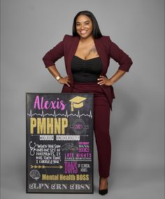 a woman standing next to a sign with writing on it