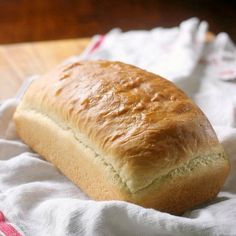 a loaf of bread sitting on top of a white cloth