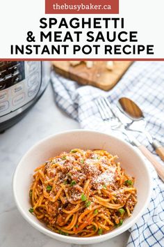 spaghetti and meat sauce in a white bowl with parmesan cheese on the side