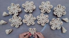 crocheted flowers are being made with yarn