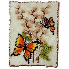 a rug with flowers and butterflies on it